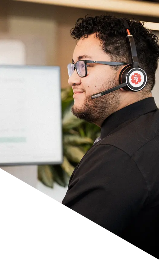 An Weatherby consultant at her desk takes a call from a provider.